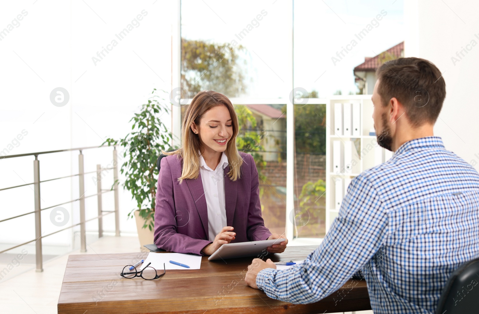 Photo of Human resources manager conducting job interview with applicant in office