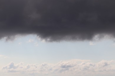 Photo of Sky with heavy rainy clouds on grey day