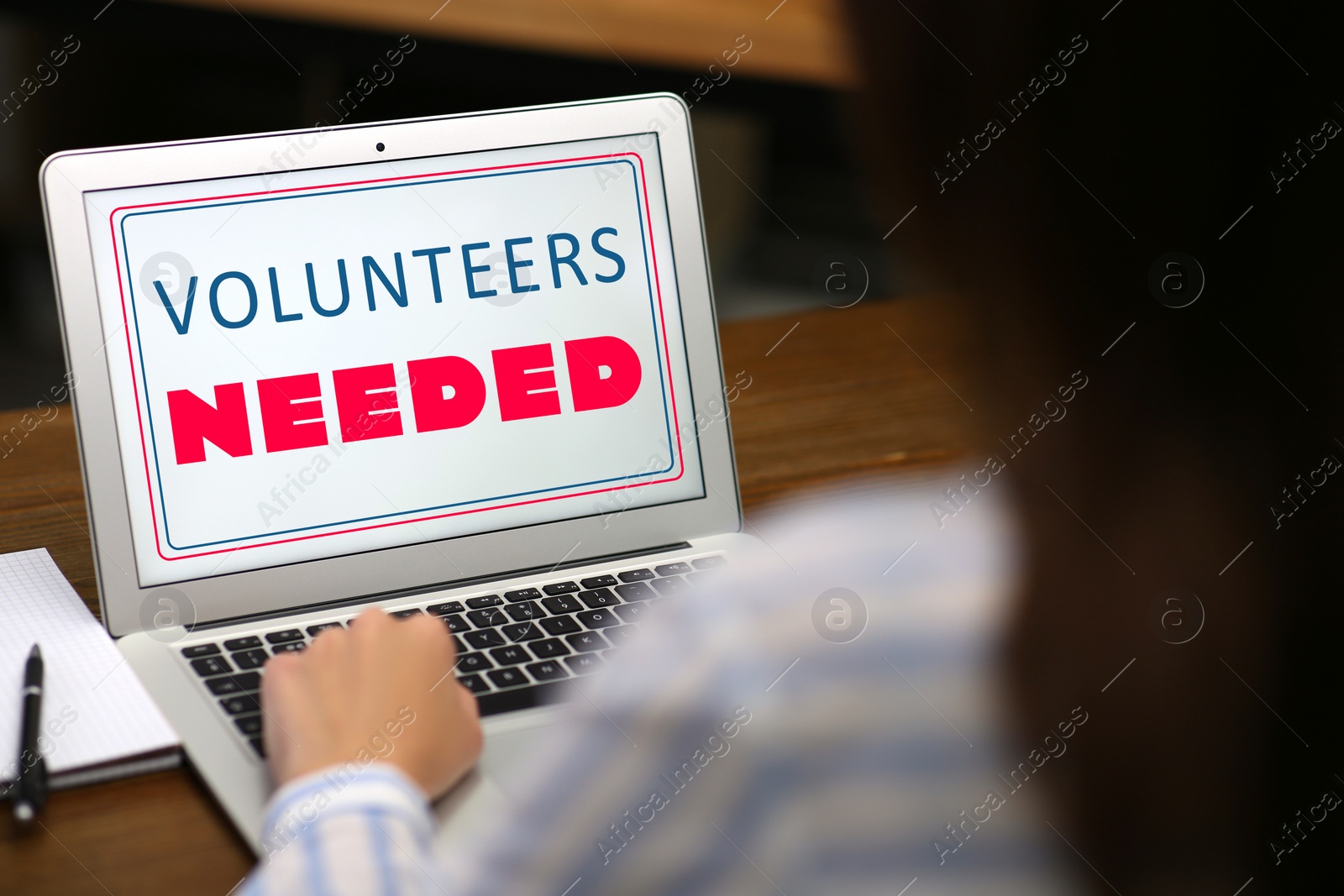 Image of Woman working on modern laptop wooden at table, closeup. Volunteers needed