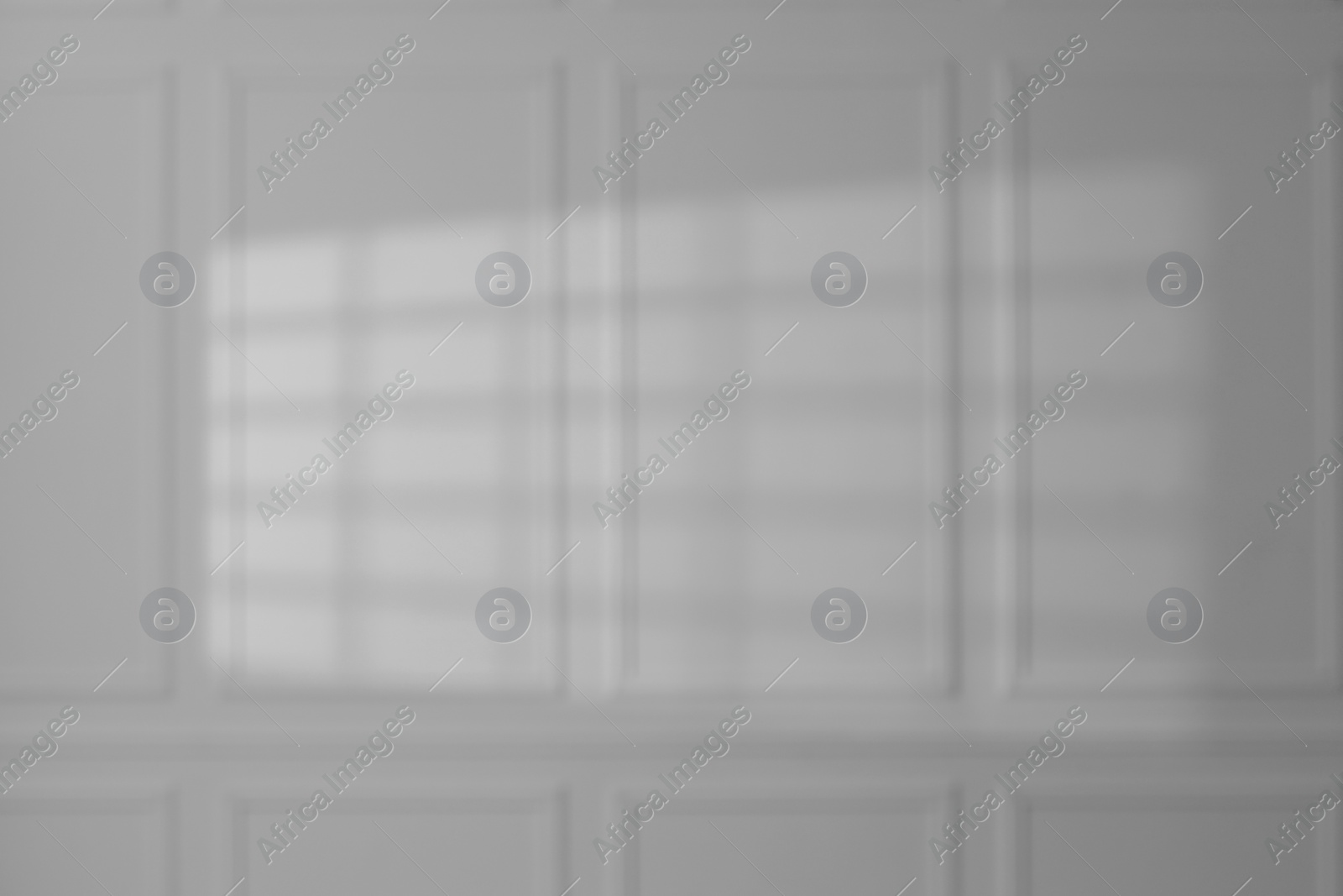 Photo of Light and shadow from window on white wall