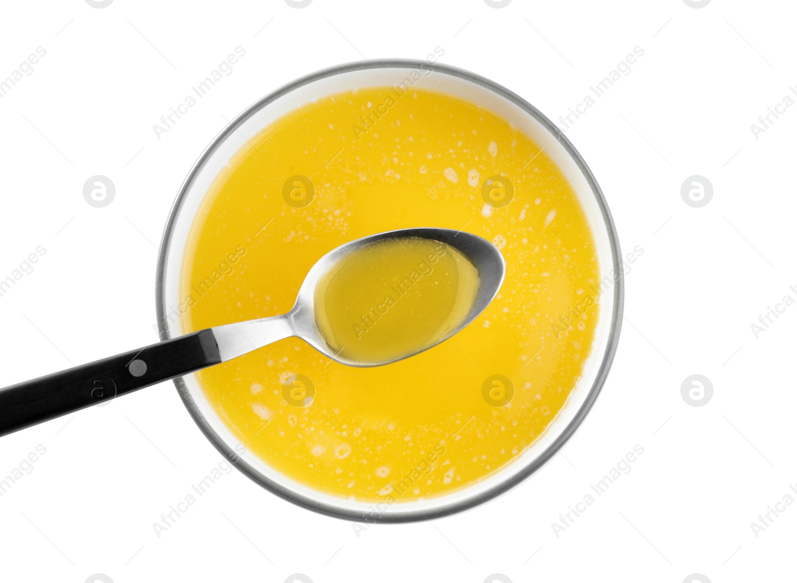 Photo of Bowl and spoon of Ghee butter isolated on white