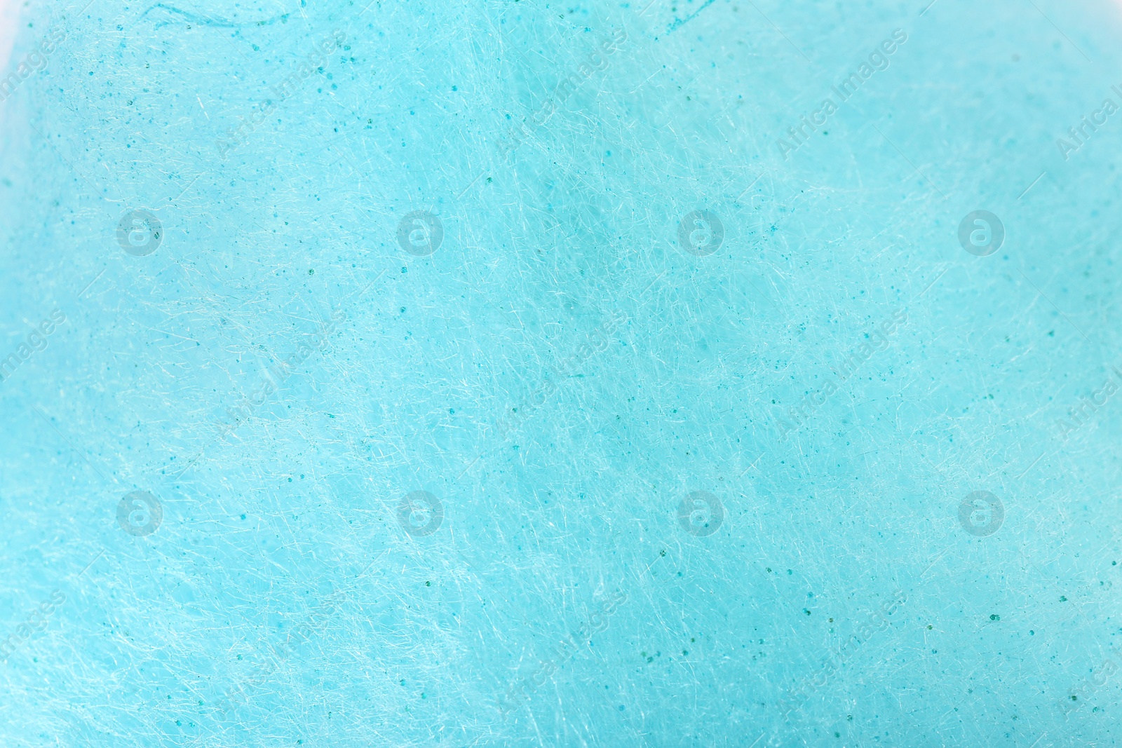 Photo of Light blue cotton candy as background, closeup