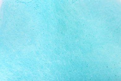 Photo of Light blue cotton candy as background, closeup