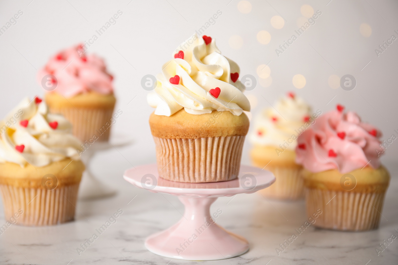 Photo of Tasty sweet cupcake on stand. Happy Valentine's Day