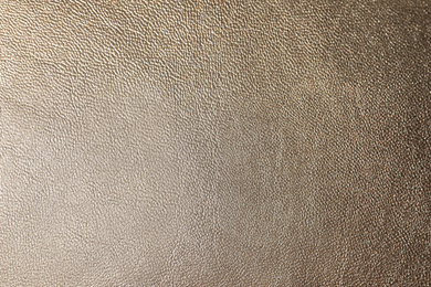 Texture of light brown leather as background, closeup