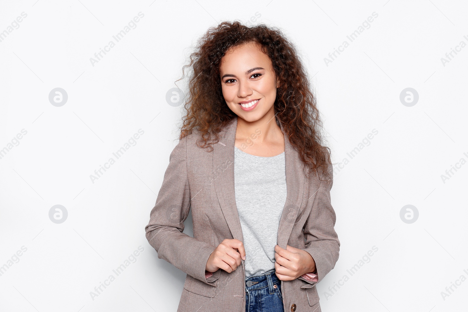 Photo of Young African-American woman with beautiful face on white background