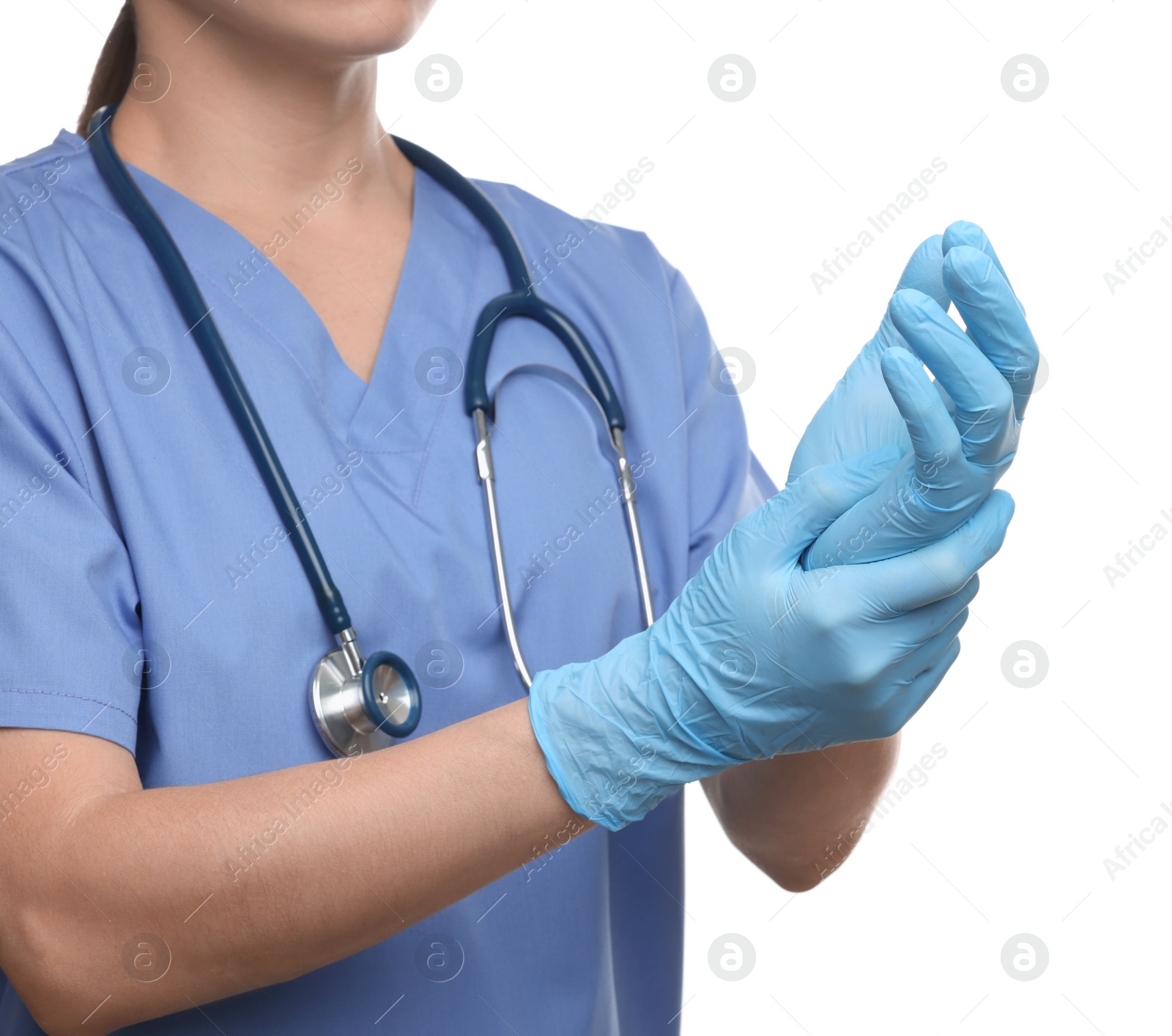 Photo of Doctor wearing light blue medical gloves on white background, closeup