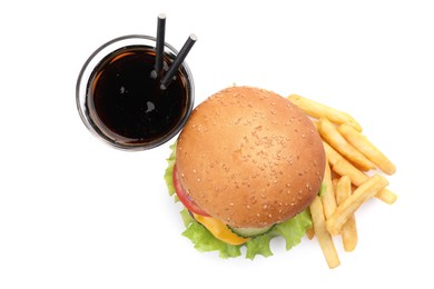 Photo of French fries, tasty burger and drink on white background, top view