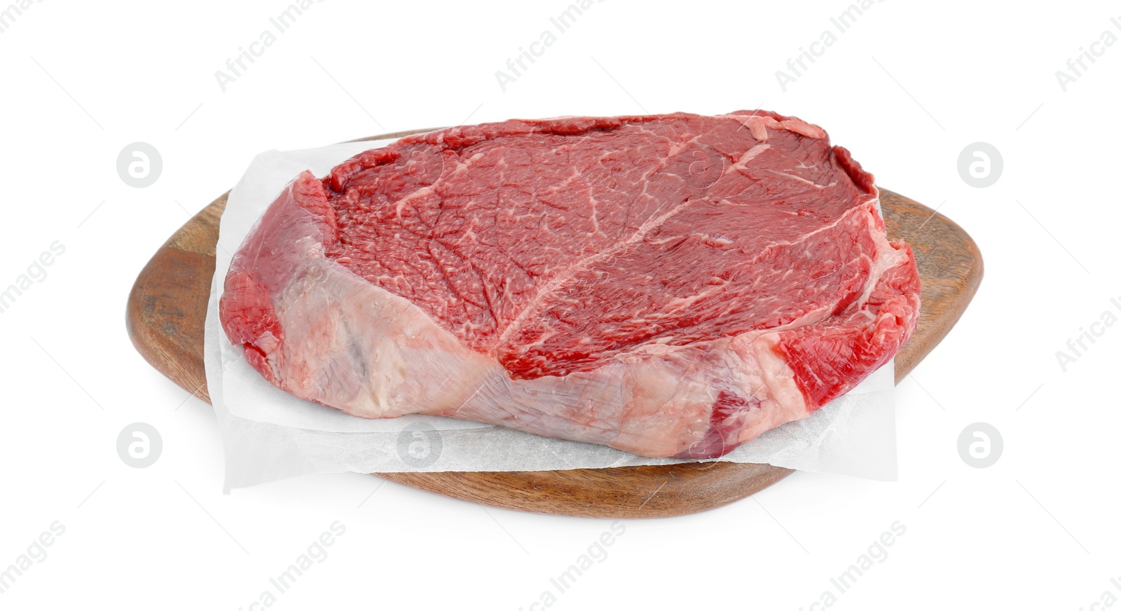 Photo of Wooden board with piece of raw beef meat isolated on white