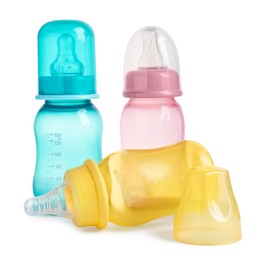 Photo of Three empty feeding bottles for baby milk isolated on white