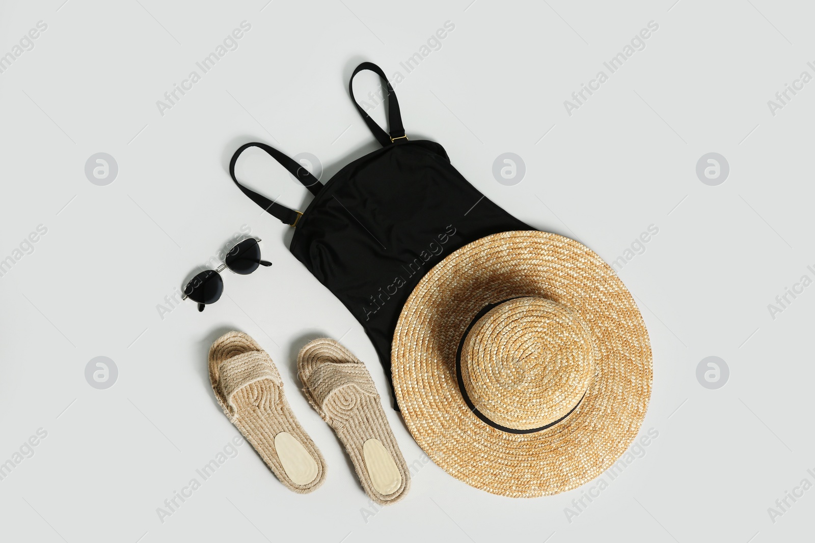 Photo of Composition with stylish beach accessories on white background, top view