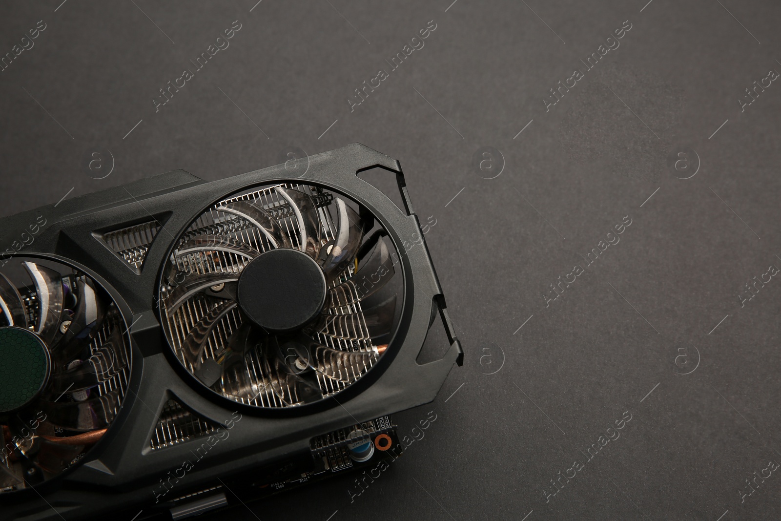 Photo of One graphics card on black background, above view. Space for text