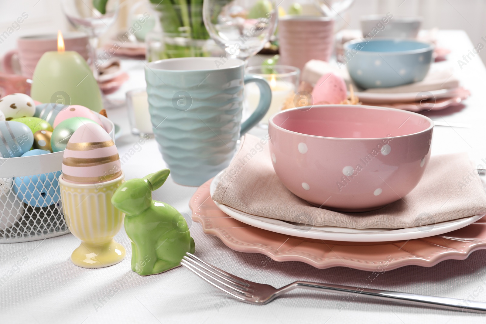 Photo of Festive table setting with elegant dishware. Easter celebration