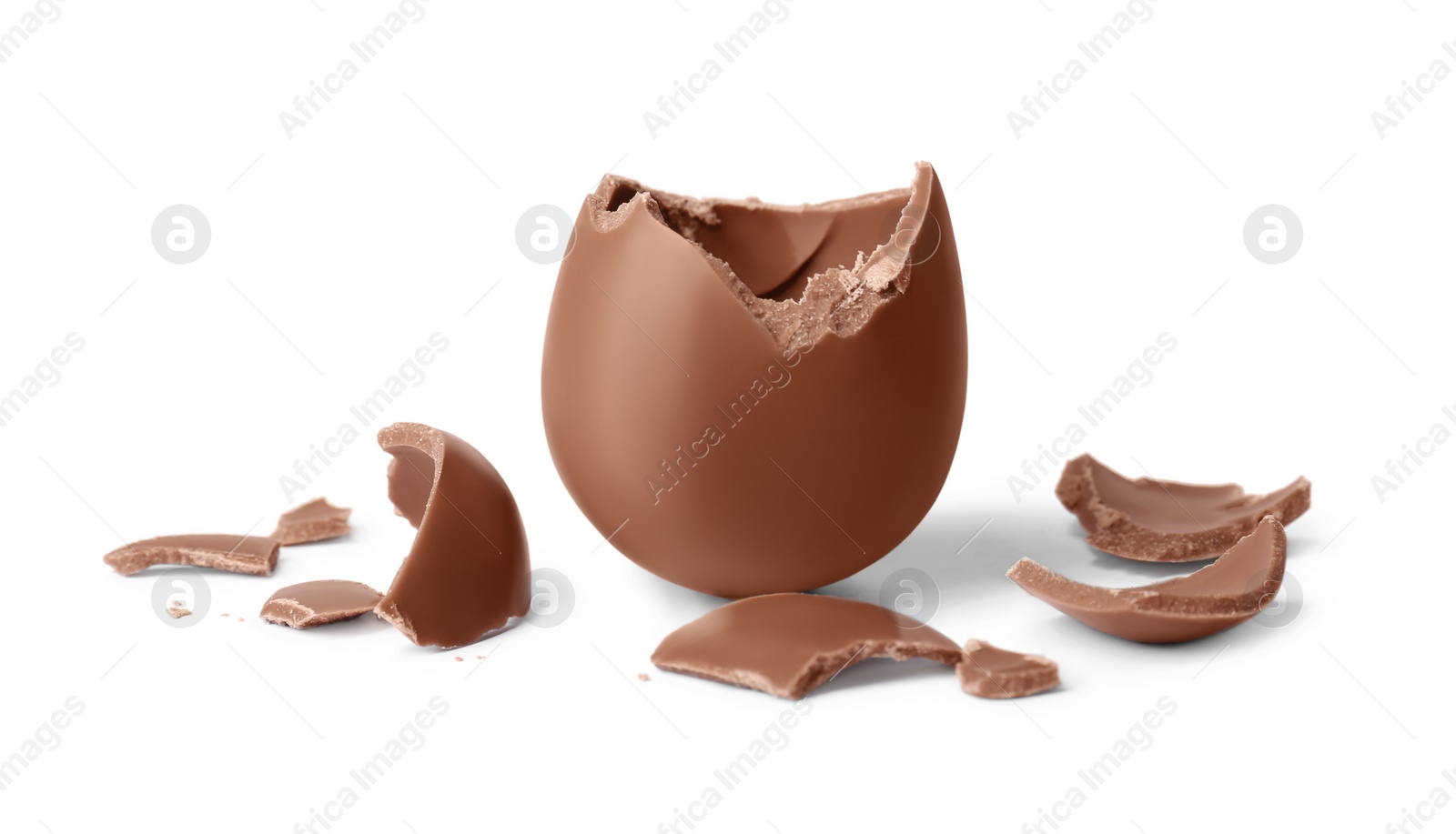 Photo of Tasty broken chocolate egg isolated on white