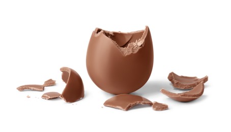 Photo of Tasty broken chocolate egg isolated on white