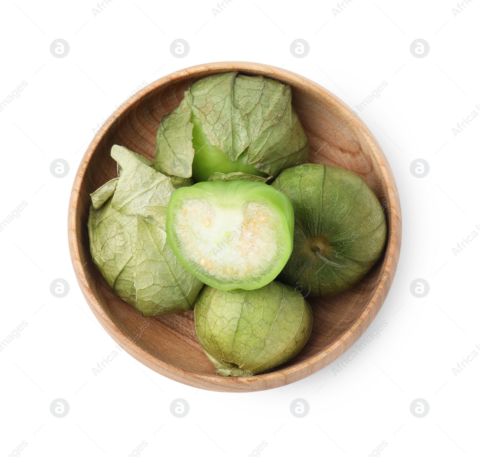 Photo of Fresh green tomatillos with husk in bowl isolated on white, top view