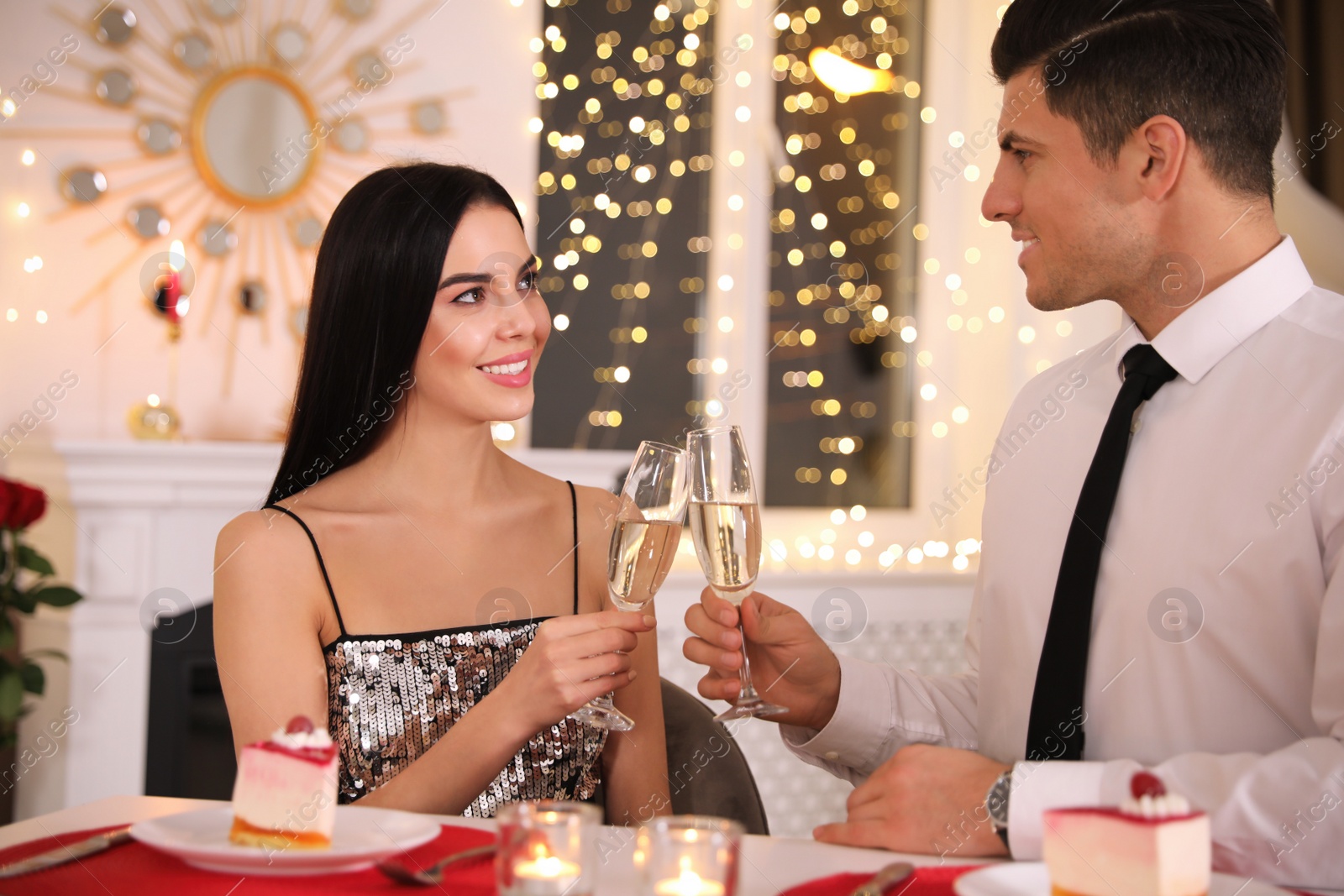 Photo of Happy couple having romantic dinner on Valentine's day in restaurant