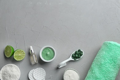 Photo of Flat lay composition with spirulina facial mask and ingredients on light grey table. Space for text