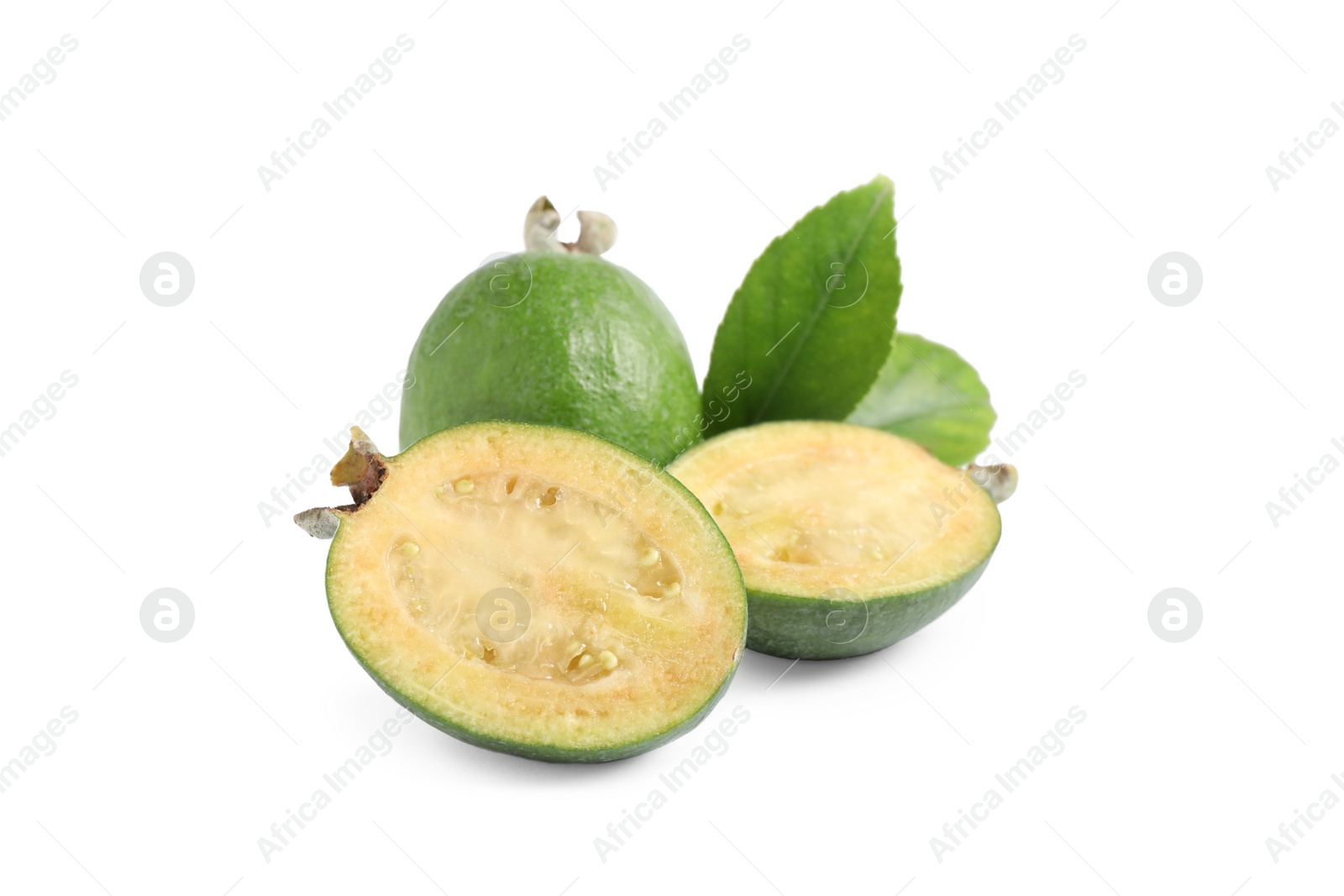 Photo of Whole and cut feijoa fruits on white background