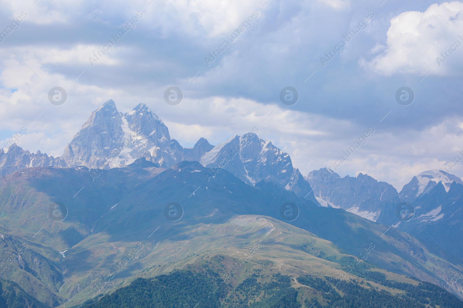 Photo of Picturesque view of mountains under cloudy sky