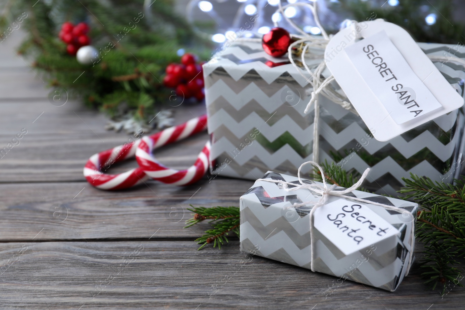 Photo of Presents from secret Santa on wooden table, space for text