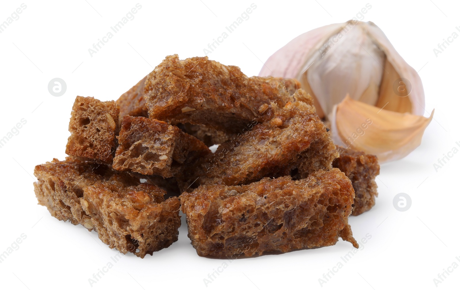 Photo of Delicious crispy rusks and garlic on white background