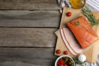 Photo of Flat lay composition with delicious smoked bacon on wooden table, space for text