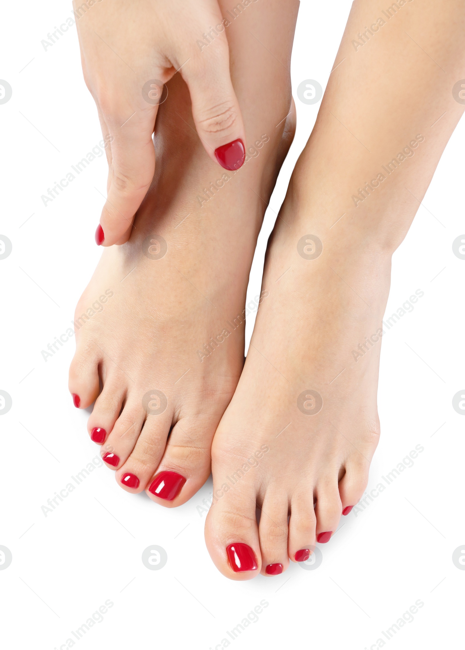 Photo of Woman with stylish red toenails after pedicure procedure isolated on white, top view