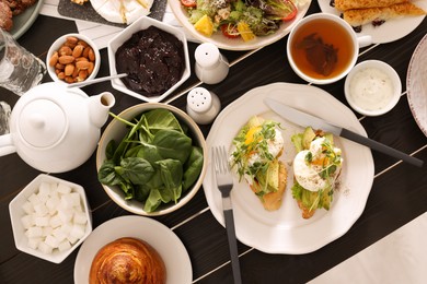 Photo of Many different dishes served on buffet table for brunch, flat lay