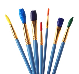 Photo of Different brushes with paints on white background