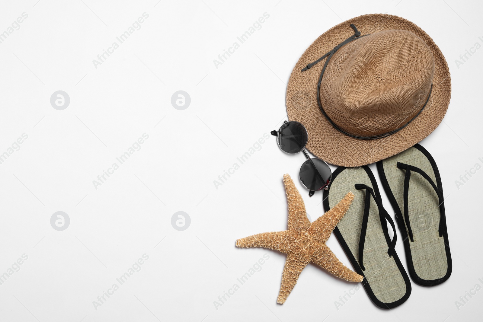 Photo of Flat lay composition with stylish beach accessories on white background