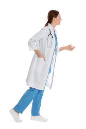 Photo of Doctor in clean uniform walking on white background