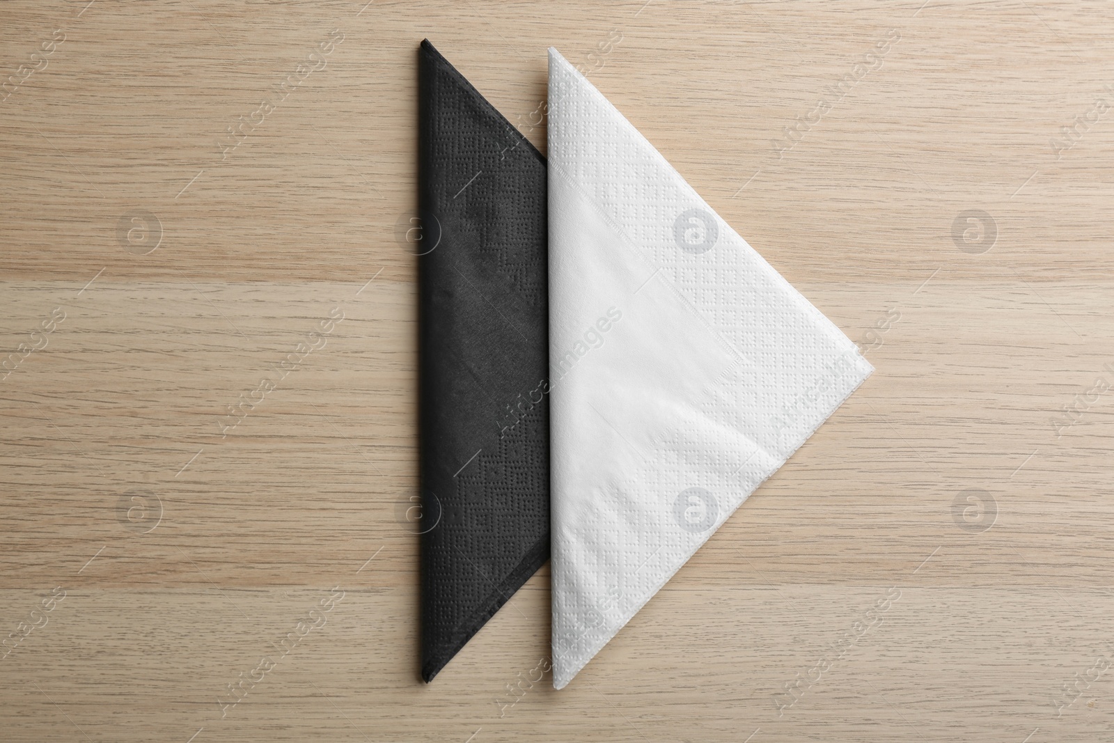 Photo of Clean paper tissues on wooden table, flat lay