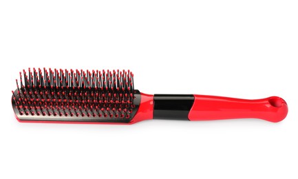 One new red hairbrush isolated on white