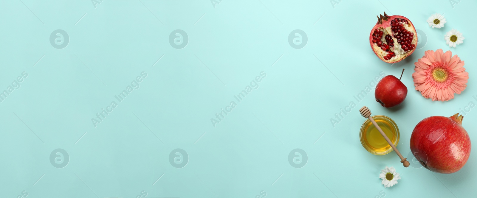 Image of Flat lay composition with Rosh Hashanah holiday attributes on turquoise background, space for text. Banner design