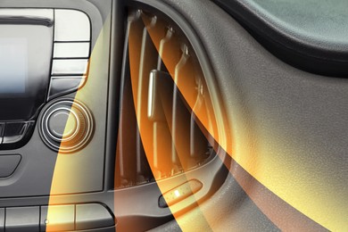 Image of Closeup view of conditioning system in car and illustration of warm air flow