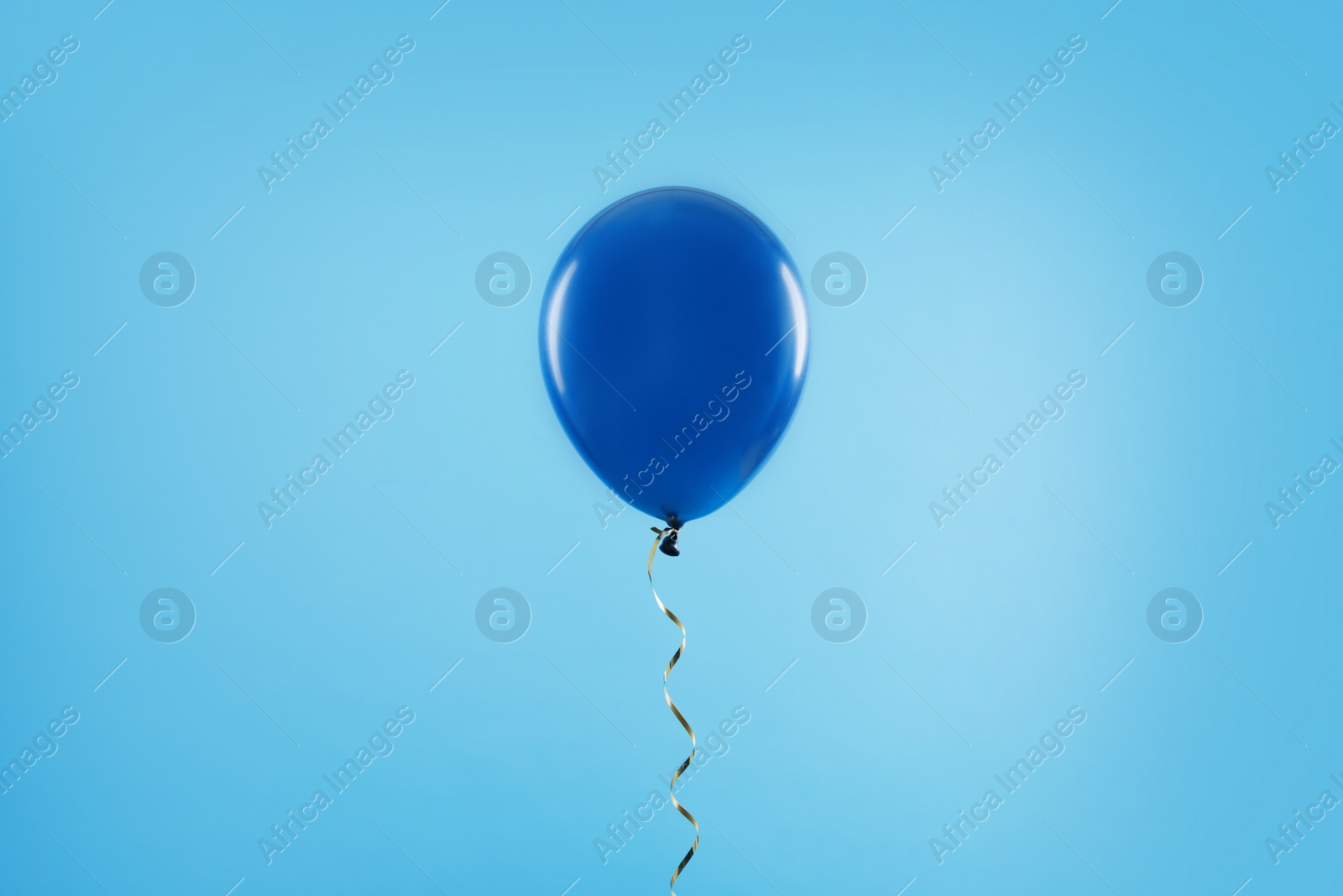 Photo of Bright balloon on color background. Celebration time