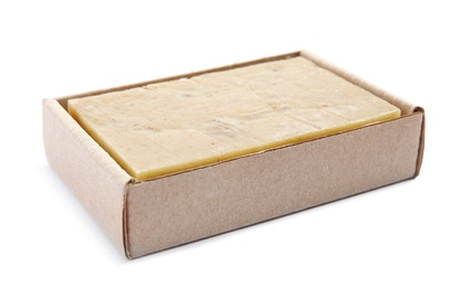 Hand made soap bar in cardboard package on white background