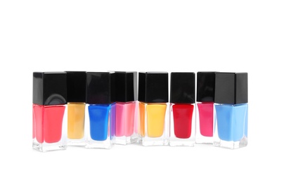 Bottles of nail polish on white background