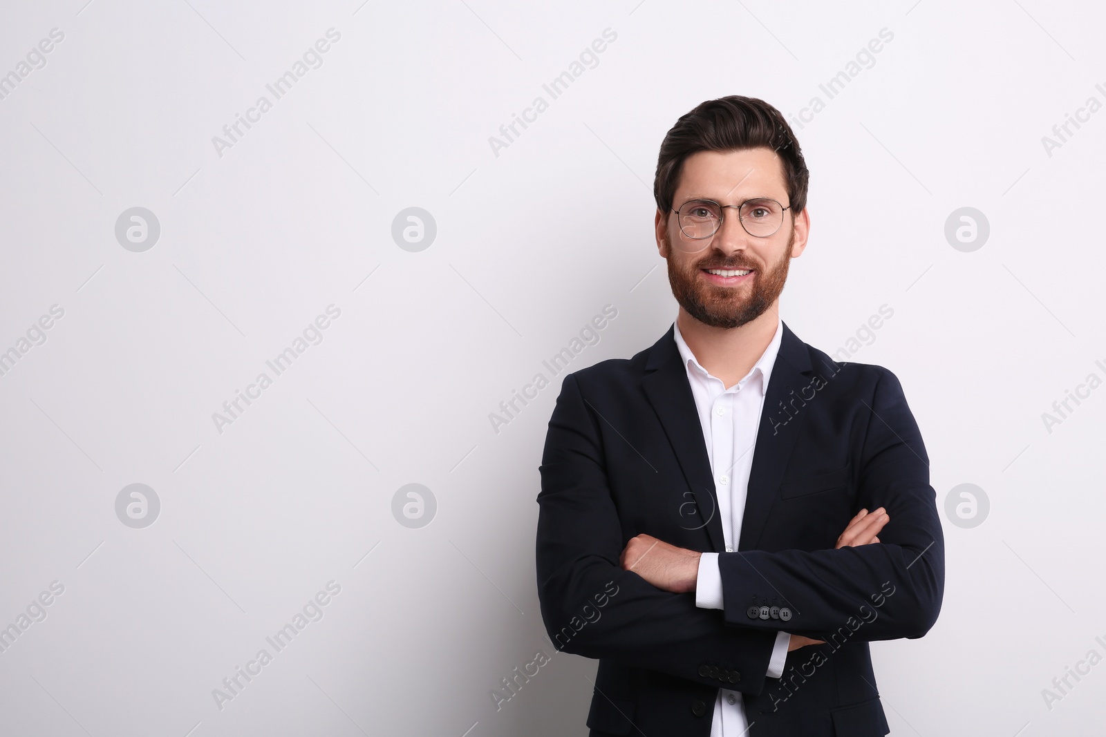 Photo of Portrait of handsome man in glasses on white background, space for text