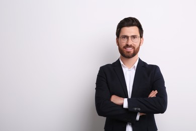 Portrait of handsome man in glasses on white background, space for text