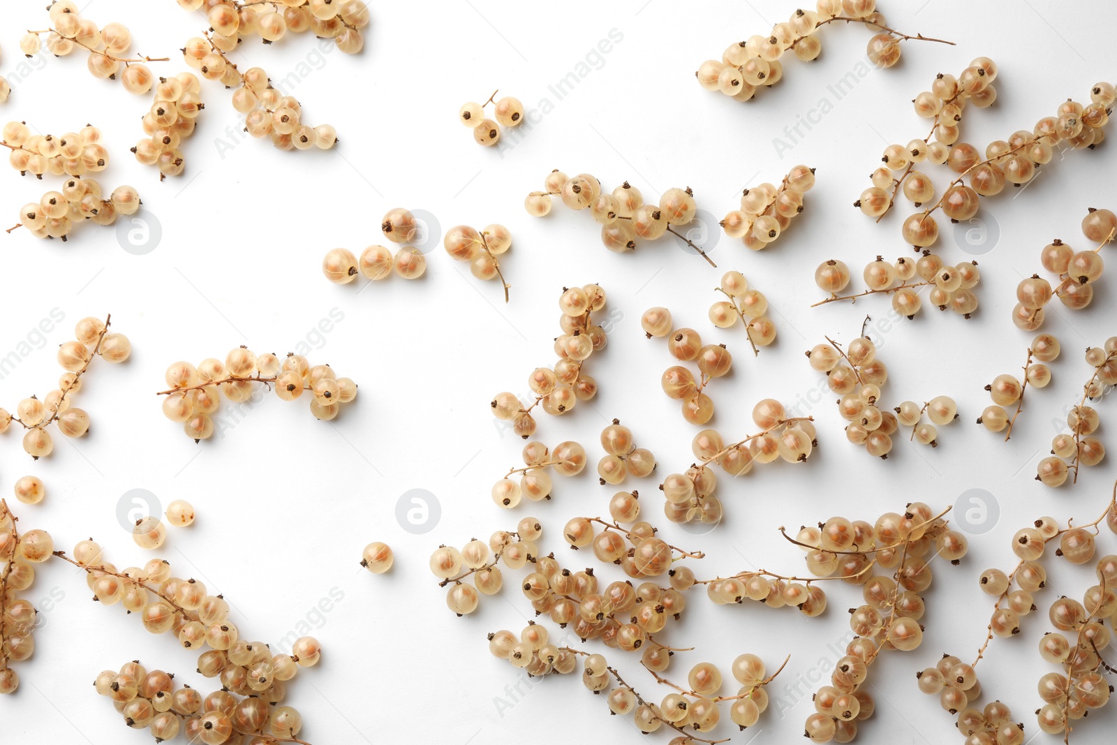 Photo of Tasty fresh currants on white background, flat lay