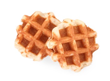 Two delicious Belgian waffles isolated on white, top view