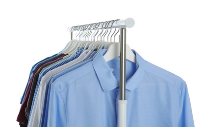 Men clothes hanging on wardrobe rack against white background