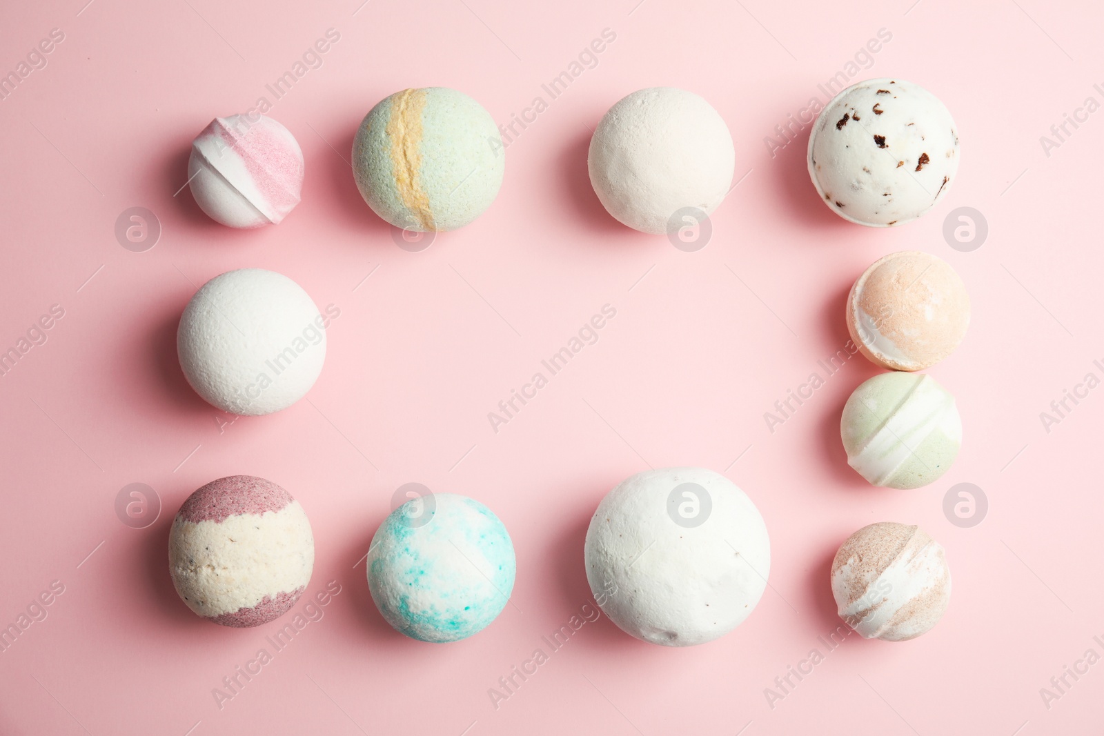 Photo of Flat lay composition with bath bombs and space for text on color background