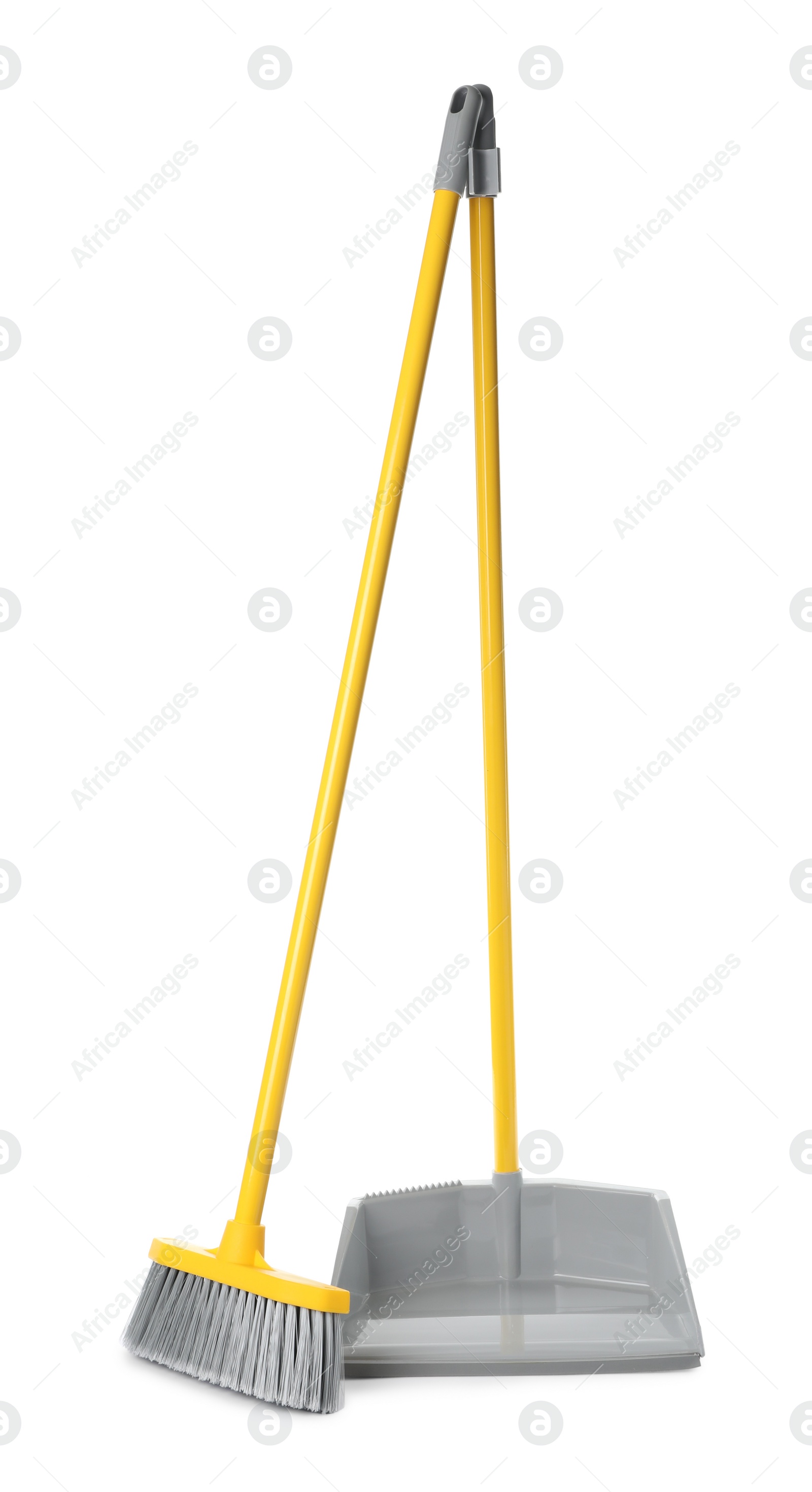 Photo of Plastic broom and dustpan on white background