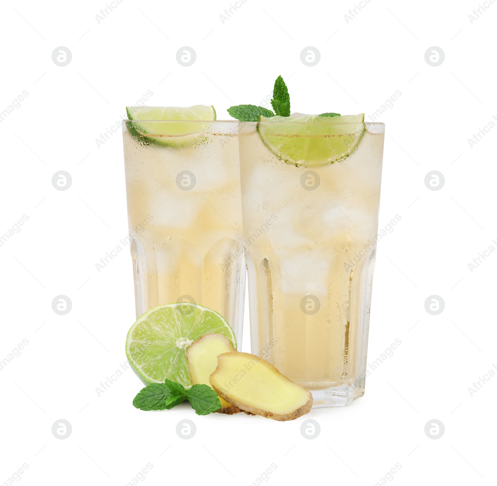 Photo of Glasses of tasty ginger ale with ice cubes and ingredients isolated on white