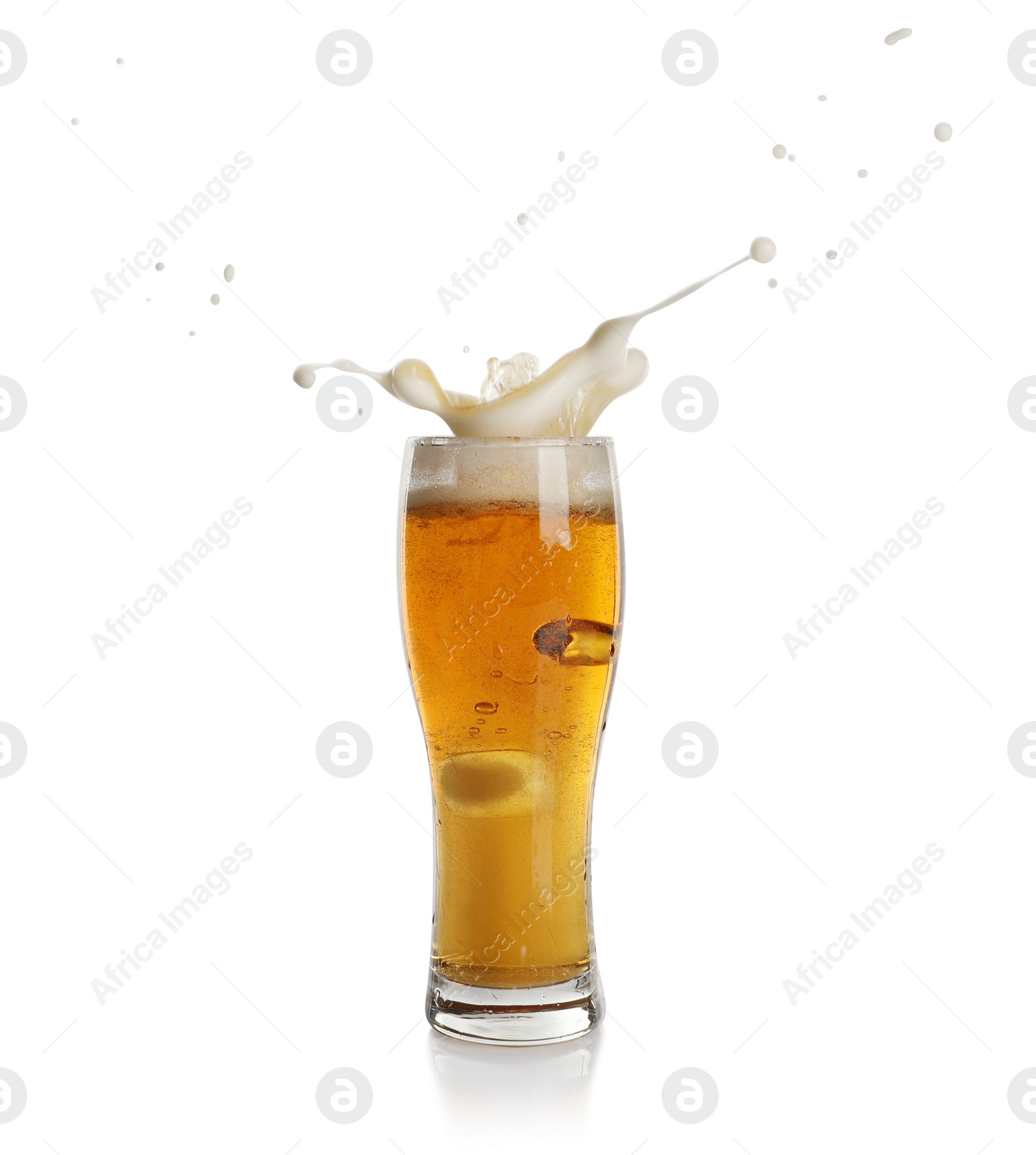 Photo of Beer splashing out of glass on white background