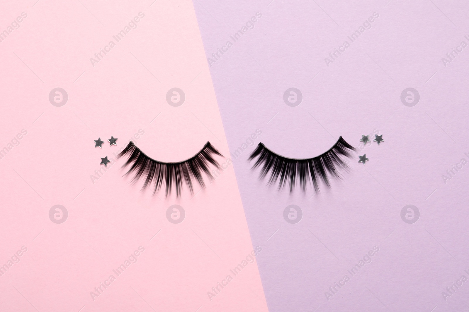 Photo of False eyelashes and sparkles on color background, flat lay