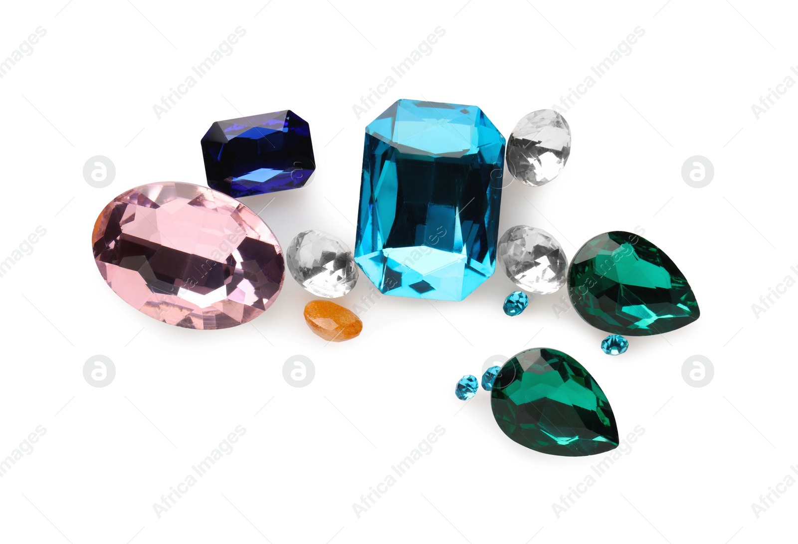 Photo of Different beautiful gemstones for jewelry isolated on white, top view